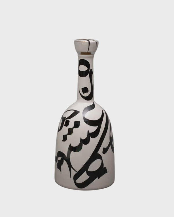 Short video of the Calligraphy Harmony Vase shown in the studio and styled on a table, a stone surface and a ledge
